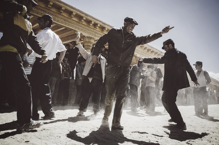 Tajik men dancing going under